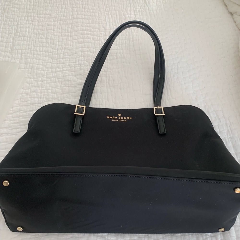 Black Kate Spade bag.